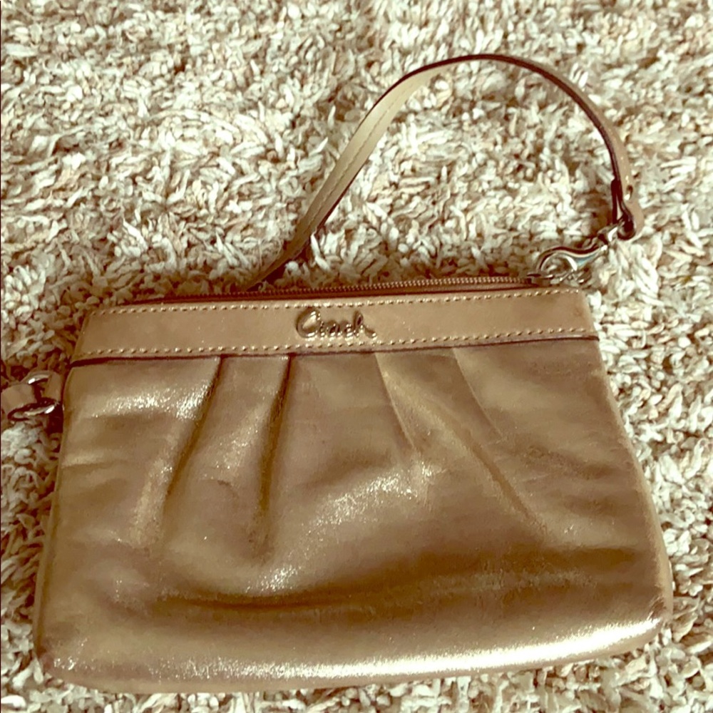 Gold metallic Coach wristlet